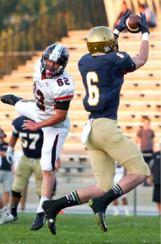 Michael Mangum  |  Special to The Salt Lake Tribune

Skyline junior tight end Riley Sharp catches a pass during the first half of their game against Murray at Skyline High School on Friday, September 19, 2014.