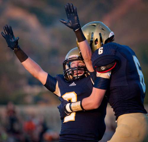 Michael Mangum  |  Special to The Salt Lake Tribune

Skyline senior Michael Binford (2) and junior Riley Sharp celebrate Sharp's first half touchdown during their game against Murray at Skyline High School on Friday, September 19, 2014.