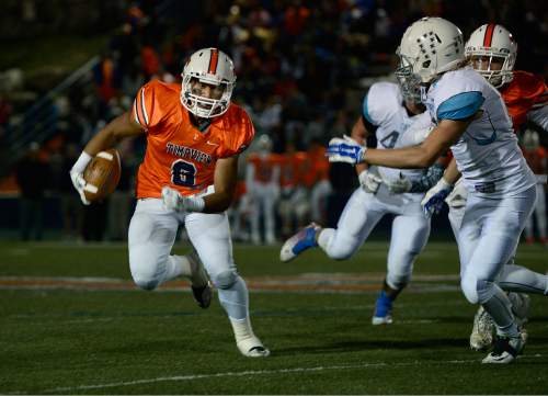 Scott Sommerdorf  |  The Salt Lake Tribune
Timpview RB Saia Folaumahina runs during second half play. Timpview beat Sky View of Smithfield, 45-8 in a 4A state quarterfinal playoff game Friday, November 7, 2014 in Provo.