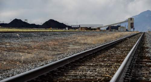 Francisco Kjolseth  |  The Salt Lake Tribune 
Coal trucked from central Utah piles up at the Levan transfer station south of Nephi, where it is loaded on Union Pacific freight cars bound for California. Utah's Community Impact Board has awarded a $53 million loan to four coal-producing counties to invest in a deep-water port in Oakland, Calif. hoping to connect central Utah commodities with export markets. Bowie Resource Partners already exports about 1 to 3 million tons of coal from its Utah mines.