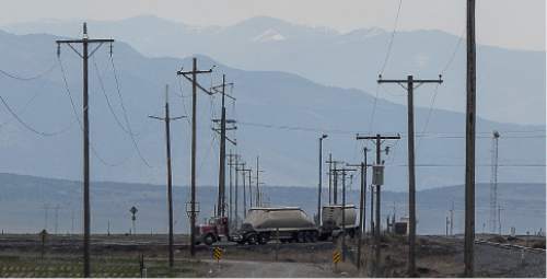 Francisco Kjolseth  |  The Salt Lake Tribune 
The Levan transfer facility along Interstate 15 south of Nephi sees a steady flow of coal trucks before it is loaded on to trains. Utah's Community Impact Board has awarded a $53 million loan to four coal-producing counties to invest in a deep-water port in Oakland, Calif. hoping to connect central Utah commodities with export markets. Bowie Resource Partners already exports about 1 to 3 million tons of coal from its Utah mines.