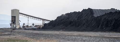 Francisco Kjolseth  |  The Salt Lake Tribune 
Coal trucked from central Utah piles up at the Levan transfer station south of Nephi, where it is loaded on Union Pacific freight cars bound for California. Utah's Community Impact Board has awarded a $53 million loan to four coal-producing counties to invest in a deep-water port in Oakland, Calif. hoping to connect central Utah commodities with export markets. Bowie Resource Partners already exports about 1 to 3 million tons of coal from its Utah mines.