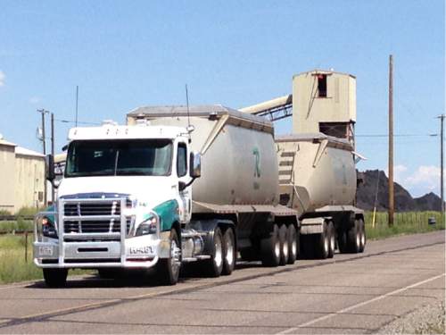 Lee Davidson  |  The Salt Lake Tribune 

Coal trucks arriving at a railroad siding near Levan. A proposed $124 million railroad from Salina to Levan could eliminate heavy shipments by truck of coal from the Sufco mine.