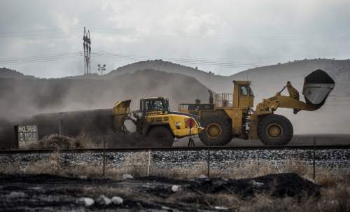 Francisco Kjolseth  |  The Salt Lake Tribune 
Crews move coal at the Levan transfer facility along Interstate 15 south of Nephi where a steady flow of trucks unload it before it is transferred to train cars. Utah's Community Impact Board has awarded a $53 million loan to four coal-producing counties to invest in a deep-water port in Oakland, Calif. hoping to connect central Utah commodities with export markets. Bowie Resource Partners already exports about 1 to 3 million tons of coal from its Utah mines.