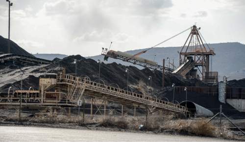 Francisco Kjolseth  |  The Salt Lake Tribune 
Coal trucked from central Utah piles up at the Levan transfer station south of Nephi, where it is loaded on Union Pacific freight cars bound for California. Utah's Community Impact Board has awarded a $53 million loan to four coal-producing counties to invest in a deep-water port in Oakland, Calif. hoping to connect central Utah commodities with export markets. Bowie Resource Partners already exports about 1 to 3 million tons of coal from its Utah mines.