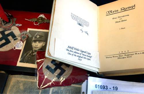 Scott Sommerdorf   |  The Salt Lake Tribune
A grouping of German WWII artifacts including a copy of "Mein Kampf" signed by Adolf Hitler were on display at Fort Douglas Military Museum's V.J. Day program -- 1945: The Year That Changed The World, Saturday, August 15, 2015.