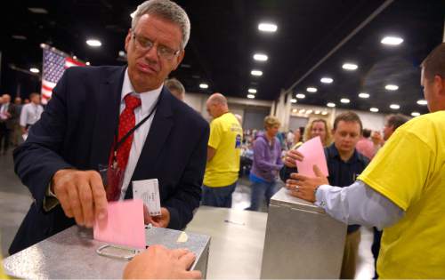 Leah Hogsten  |  The Salt Lake Tribune
Utah GOP delegate Ed Redd casts his vote for the offices of treasurer, secretary and vice-chair. The Utah Republican Party held its annual convention, primarily to adopt changes to their constitution and bylaws to comply with the SB54 (Count My Vote) law for the 2016 election on Saturday.