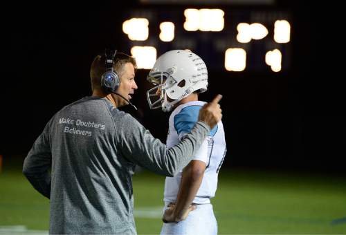 Scott Sommerdorf  |  The Salt Lake Tribune
Sky View head coach Craig Ahnder talks with QB Garrison Beach on the sidelines during the late stages of their loss to Timpview. Timpview beat Sky View of Smithfield, 45-8 in a 4A state quarterfinal playoff game Friday, November 7, 2014 in Provo.