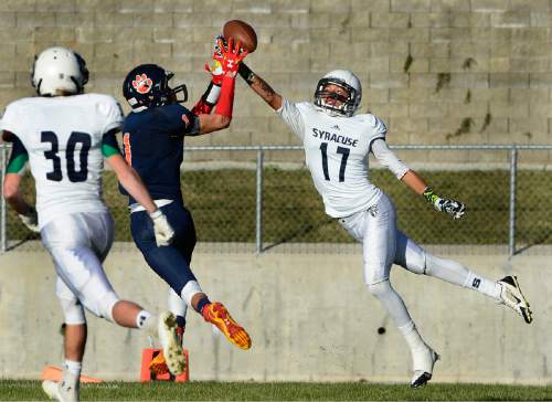 Scott Sommerdorf  |  The Salt Lake Tribune
Brighton DB Simi Fehoko breaks up a pass intended for Syracuse WR Daunte Atkinson during first half play. Brighton beat Syracuse 35-14 in a 5A first-round playoff game at Brighton, Friday, October 31, 2014.