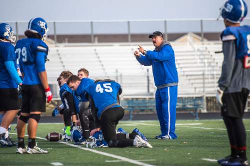 Chris Detrick  |  The Salt Lake Tribune
Bingham High coach Dave Peck works with members of the Bingham High School football team as they practice Wednesday December 17, 2014. Bingham will compete in the State Champions Bowl Series December 27th at Florida Atlantic University.