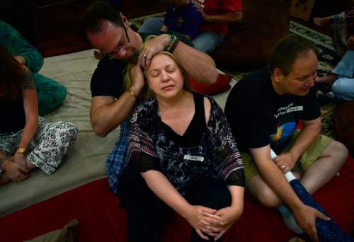 Scott Sommerdorf   |  The Salt Lake Tribune
Pam Bradford and Joe Tuttle during a "cuddle party" - a regular meet-up that happens in Utah, where strangers get together and cuddle in a nonsexual way, Friday, July, 31, 2015.