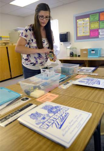 Al Hartmann  |  The Salt Lake Tribune
First-year teacher Britnee Hinton finishes setting up her fifth-grade classroom for 26 students at Westbrook Elementary in Taylorsville on Tuesday, Aug. 18.  She was a student teacher at the school last year and was asked to fill a teaching position for the 2015-16 school year.  Granite School District starts classes Wednesday.