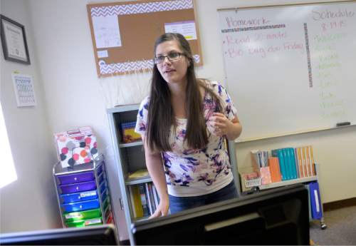 Al Hartmann  |  The Salt Lake Tribune
First-year teacher Britnee Hinton finishes setting up her fifth-grade classroom for 26 students at Westbrook Elementary in Taylorsville on Tuesday, Aug. 18.  She was a student teacher at the school last year and was asked to fill a teaching position for the 2015-16 school year.  Granite School District starts classes Wednesday.
