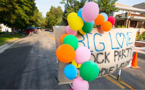 Steve Griffin  |  The Salt Lake Tribune

A sign with balloons blocks the road on 2nd avenue between H & I streets as neighbors, friends and the community meet for the Big Love Block Party in memory of James Dudley Barker who was shot and killed by a police officer on Jan. 8, 2015. The party was held to help the community heal and also a birthday celebration of Dudley Barker's life. It was held in the Avenues neighborhood in Salt Lake City, Tuesday, August 18, 2015.