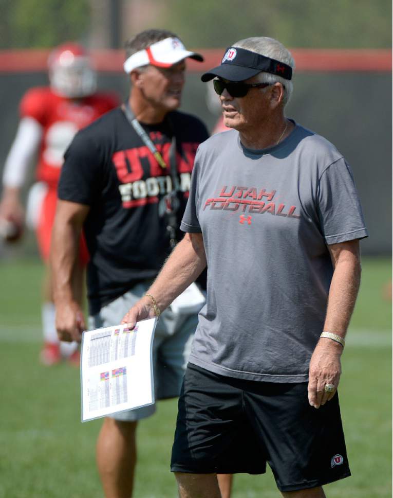 Al Hartmann  |  The Salt Lake Tribune
Assistant head coach Dennis Erickson coaches the running backs during practice Monday August 17.  Head coach Kyle Whittingham, behind.