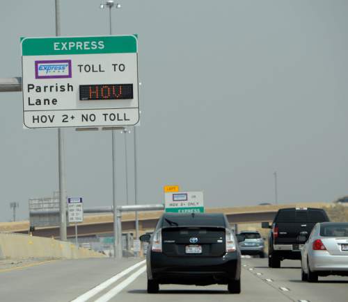 Al Hartmann  |  The Salt Lake Tribune
Traffic moves along I-15 northbound between Salt Lake City and North Salt Lake.  HOV lane at far left.