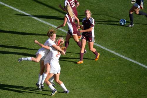 Chris Detrick  |  The Salt Lake Tribune
Davis' Regyn Youngberg (11) celebrates after scoring a goal with teammates Ireland Dunn (2) and Olivia Wade (6) during the 5A girls' state soccer championship game at Rio Tinto Stadium Friday October 24, 2014.