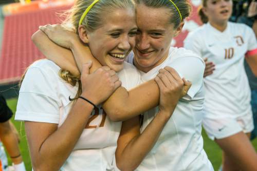 Chris Detrick  |  The Salt Lake Tribune
Davis' Mikayla Colohan (21) and Olivia Wade (6) celebrate after winning the 5A girls' state soccer championship game at Rio Tinto Stadium Friday October 24, 2014.  Davis defeated Lone Peak 2-1.