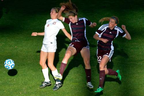 Chris Detrick  |  The Salt Lake Tribune
Davis' Olivia Wade (6) Lone Peak's Natalie Lewis (12) and Lone Peak's Ellison Smith (22) go for the ball during the 5A girls' state soccer championship game at Rio Tinto Stadium Friday October 24, 2014.