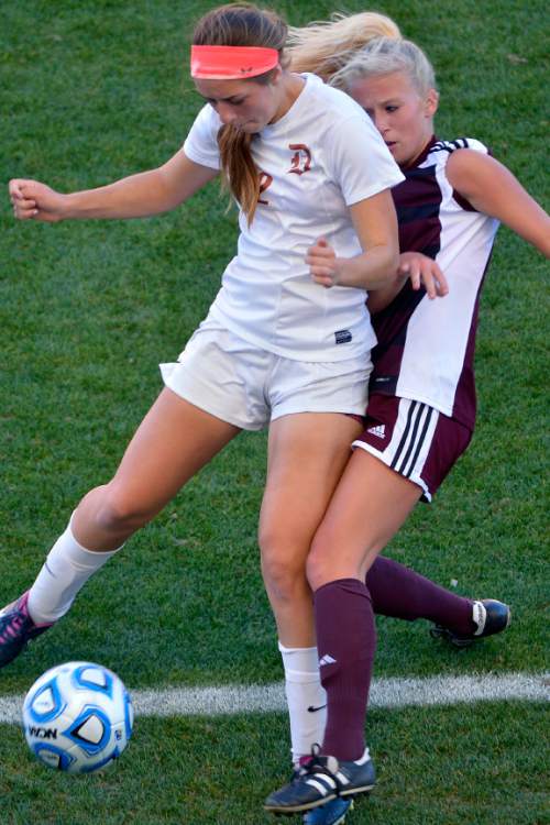 Chris Detrick  |  The Salt Lake Tribune
Davis' Ireland Dunn (2) and Lone Peak's Leesa Stowe (15) go for the ball during the 5A girls' state soccer championship game at Rio Tinto Stadium Friday October 24, 2014.