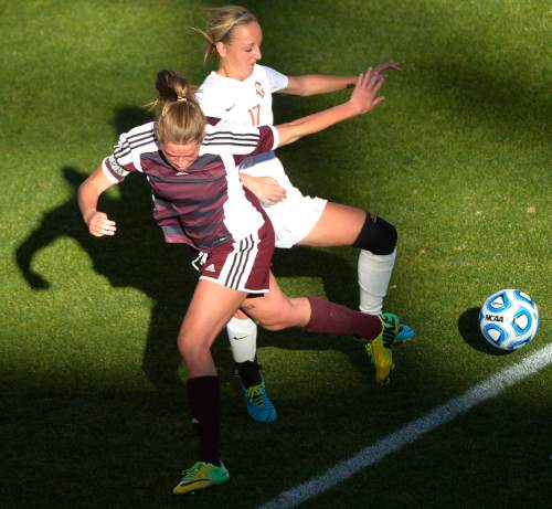 Chris Detrick  |  The Salt Lake Tribune
Lone Peak's Katie Gurney (37) and Davis' Madison Carter (17) go for the ball during the 5A girls' state soccer championship game at Rio Tinto Stadium Friday October 24, 2014.