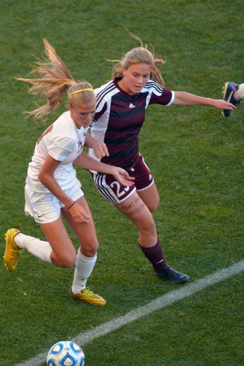 Chris Detrick  |  The Salt Lake Tribune
Davis' Mikayla Colohan (21) and Lone Peak's Mattie James (25) go for the ball during the 5A girls' state soccer championship game at Rio Tinto Stadium Friday October 24, 2014.