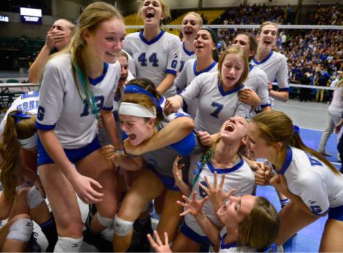 Scott Sommerdorf  |  The Salt Lake Tribune
Pleasant Grove celebrates after they defeated Lehi 3-1 to win the state 5A volleyball championship at UCCU, Saturday, November 8, 2014.