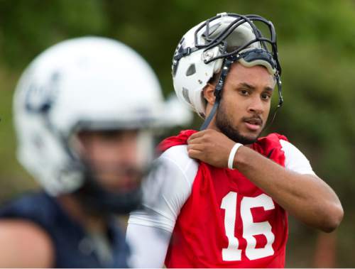 Steve Griffin  |  The Salt Lake Tribune

Utah State quarterback Chuckie Keeton listens to his coaches during opening day of football practice in Logan, Friday, August 7, 2015.  l