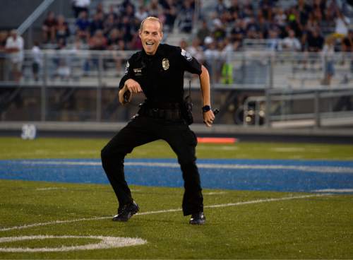 Scott Sommerdorf   |  The Salt Lake Tribune
Pleasant Grove school officer Bryson Lystrup busts out a "Watch me Whip" dance during halftime. Pleasant Grove held a 14-10 lead at the half over Corner Canyon in Pleasant Grove, Friday, August 20, 2015.