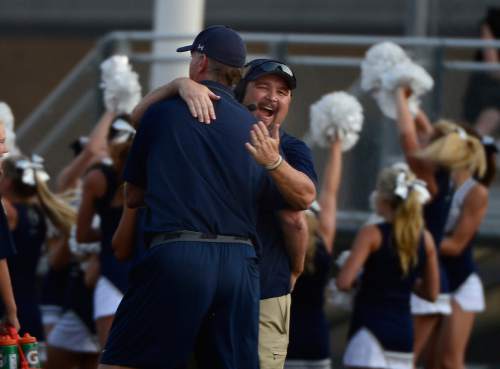 Scott Sommerdorf   |  The Salt Lake Tribune
Corner Canyon coaches celebrate a kickoff return for TD to tie the game 7-7 during first half play. Pleasant Grove held a 28-19 4th quarter lead over Corner Canyon in Pleasant Grove, Friday, August 20, 2015.