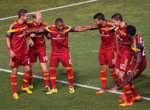 Michael Mangum  |  Special to the Tribune

Real Salt Lake forward Joao Plata (8) and his teammates celebrate his second half penalty kick score during their match against Sporting Kansas City at Rio Tinto Stadium in Sandy, UT on Friday, July 24, 2015. Real Salt Lake lead 1-0 at halftime.