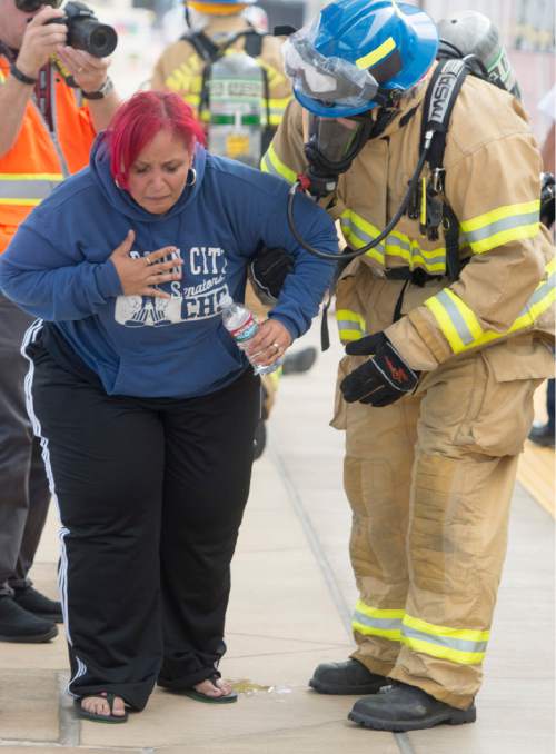 Rick Egan  |  The Salt Lake Tribune

Salt Lake Fire Fighters treat a victim during a terrorist attack response drill by UTA at the TRAX station at the Salt Lake City Airport, Wednesday, August 12, 2015.
