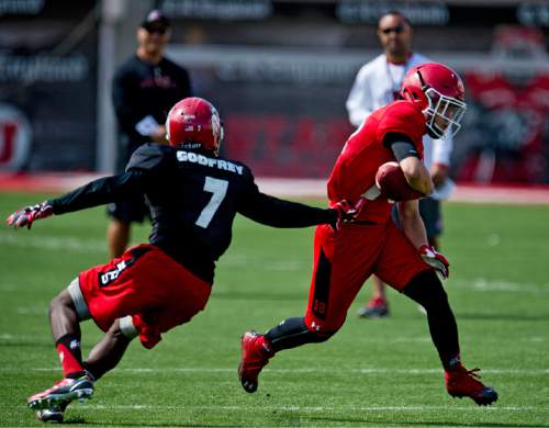 Lennie Mahler  |  The Salt Lake Tribune

Wide receiver Britain Covey gains some extra yards on a pass during Utah football fall camp at Rice-Eccles Stadium in Salt Lake City.  Saturday, Aug. 8, 2015.