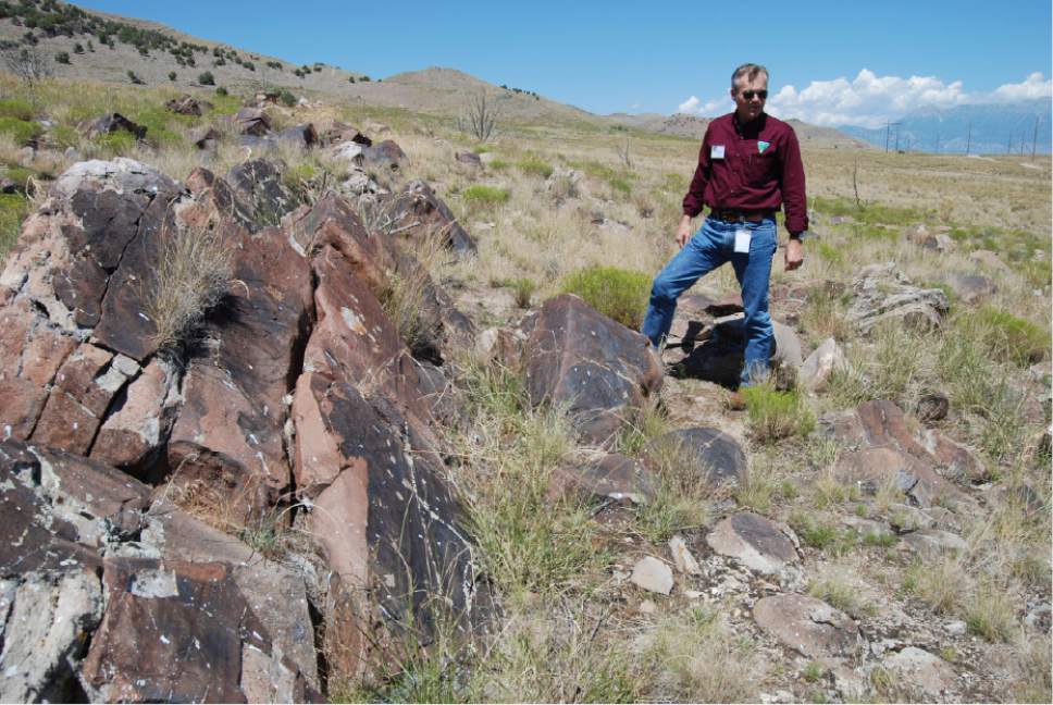 Brian Maffly  |  The Salt Lake Tribune 

Mike Sheehan, a BLM archaeologist, describes ancient petroglyphs at Utah's Lake Mountains that have been damaged by gunfire.