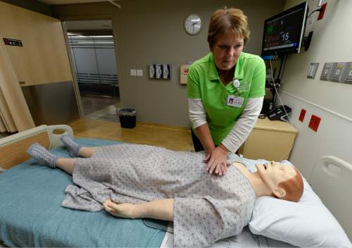Francisco Kjolseth | The Salt Lake Tribune
RN Dalene Cummings of the Dixie South West Region does a compression simulation on a dummy as Intermountain Healthcare shows off the state's largest and most advanced medical simulation center at LDS Hospital in Salt Lake City. The center is equipped with advanced simulation technology that allows staff the opportunity to develop and practice physical skills, critical thinking, decision-making, collaboration, and communication in a safe, realistic environment.