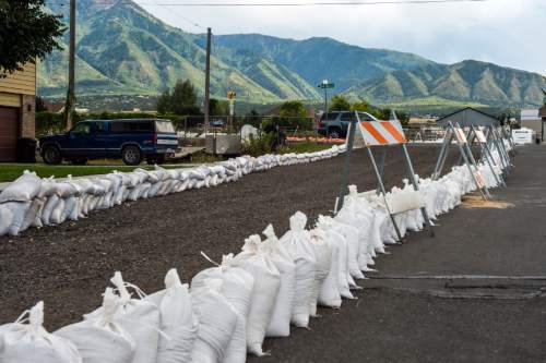 Chris Detrick  |  The Salt Lake Tribune
Sandbags along 300 West to help protect homes from water from the West Salem Canal breach Tuesday August 25, 2015.
