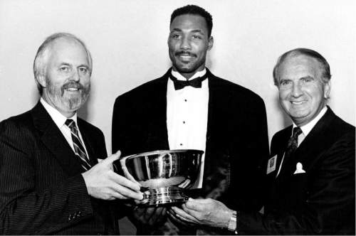 Tribune file photo
James Buckley and Karl Malone with Fred Ball.