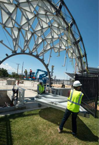 Steve Griffin  |  The Salt Lake Tribune


A crew from Erichsen Construction Services starts to dismantle the Hoberman Arch from Rice-Eccles stadium in Salt Lake City, Utah Friday, August 1, 2014. The university is giving it to Salt Lake City. The city doesn't know yet what it will do with the Olympic Legacy sculpture but, for the time being, will put it in storage.