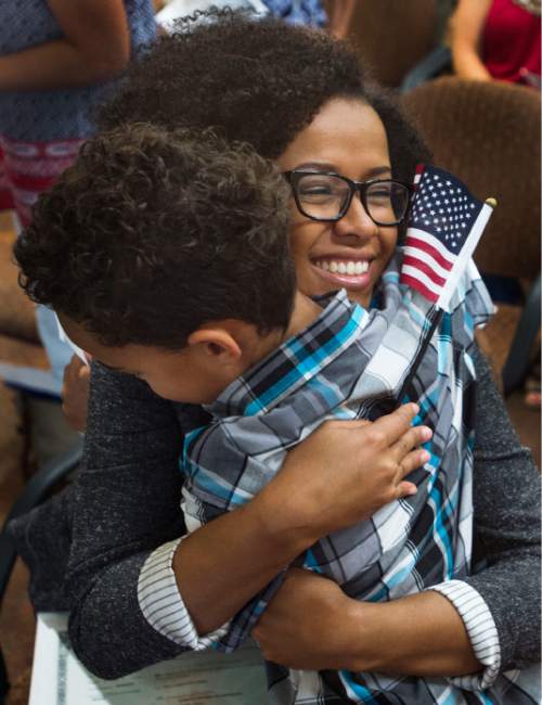 Steve Griffin  |  The Salt Lake Tribune

Adriana Marshall is all smiles as she hugs her son, Thomas, as she joined 12 other immigrants who became American citizens during a naturalization ceremony at the South Jordan Library, Monday, August 24, 2015. Marshall, who lives in Orem, Utah with her son and husband Brad, was born in Brazil, and became a citizen after living here for eight years.
