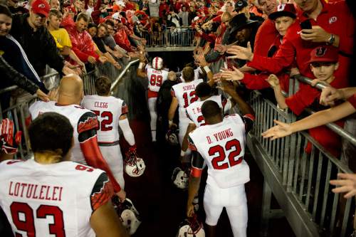 Jeremy Harmon  |  The Salt Lake Tribune

The Utes leave the field after beating Michigan in Ann Arbor, Saturday, Sept. 20, 2014.
