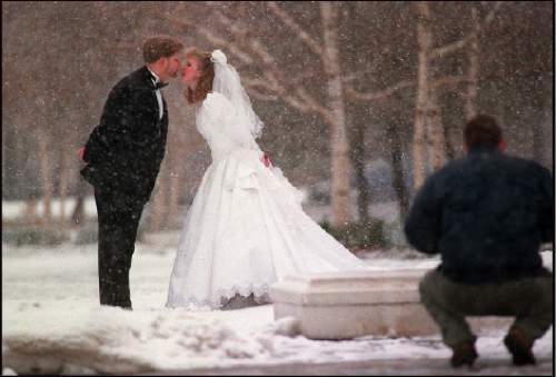 Rick Egan  |  Tribune file photo 
Newlyweds get their photo taken after being married in the Salt Lake LDS Temple.