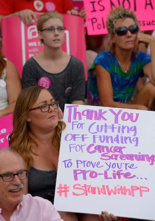Leah Hogsten  |  The Salt Lake Tribune
The Utah Capitol was covered in pink August 25, 2015 as Planned Parenthood Action Council of Utah held a community rally and proponents of the family- planning organization gathered. Governor Gary Herbert has said the money that would have gone to Planned Parenthood will be redirected to 26 health agencies in the state in 49 locations. Planned Parenthood estimates it will lose $75,000 of STD testing and more than $100,000 for educational programs.