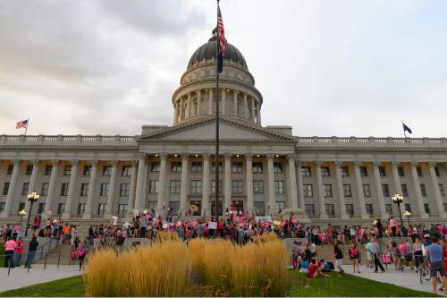 Leah Hogsten  |  The Salt Lake Tribune
The Utah Capitol was covered in pink August 25, 2015 as Planned Parenthood Action Council of Utah held a community rally and proponents of the family- planning organization gathered. Governor Gary Herbert has said the money that would have gone to Planned Parenthood will be redirected to 26 health agencies in the state in 49 locations. Planned Parenthood estimates it will lose $75,000 of STD testing and more than $100,000 for educational programs.