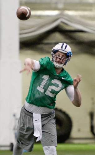 Francisco Kjolseth  |  The Salt Lake Tribune 
BYU quarter back McCoy Hill finds his target as football opens spring camp on Monday, March 2, 2015, with indoor practice at the Smith Fieldhouse.