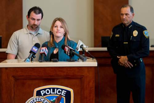 Trent Nelson  |  The Salt Lake Tribune
James Bratcher and Veronica Kasprzak speak as Draper police chief Bryan Roberts looks on after announcing the arrest of a juvenile suspect for the 2012 murder of Kasprzak's then 15-year-old daughter Anne Kasprzak. Police announced the arrest at the City Council Chambers in Draper, Thursday October 16, 2014.