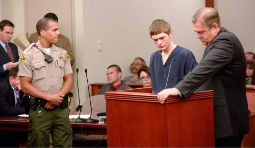 Al Hartmann  |  The Salt Lake Tribune
Darwin Christopher Bagshaw, now 18, attends a disposition hearing before 3rd District Judge James Blanch in Salt Lake City Friday July 31 with his defense lawyer Christopher Bown.   A jury trial date was set for the end of the year. 
The teen is accused of killing his 15-year-old girlfriend, Anne Kasprzak, in March 2012, when he was 14.
Bagshaw was originally charged as a juvenile, but a juvenile court judge in April transferred it to adult court.