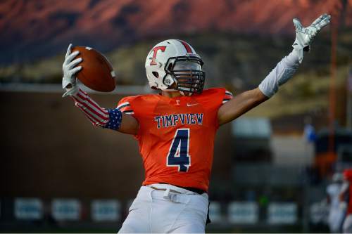 Scott Sommerdorf  |  The Salt Lake Tribune
Timpview WR Samson Nacua celebrates his 51 yard TD catch and run to give Timpview a very early 14-0 lead. Timpview beat Sky View of Smithfield, 45-8 in a 4A state quarterfinal playoff game Friday, November 7, 2014 in Provo.
