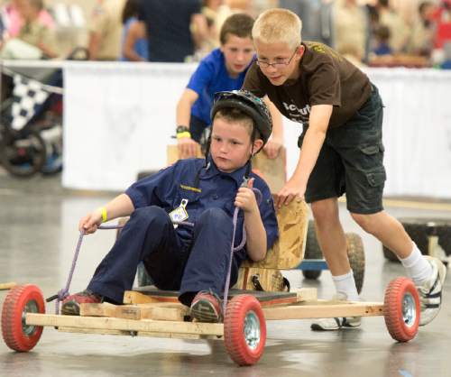 Rick Egan  |  The Salt Lake Tribune
Lincoln Halladay, 11, pushes his brother Elisha, 8, in the Push Cart Derby, at the Utah Scouting Expo at the South Towne Expo Center on Saturday, May 2, 2015.