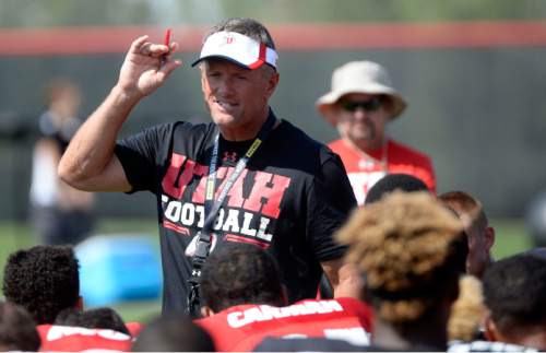 Al Hartmann  |  The Salt Lake Tribune
Ute head coach Kyle Whittingham gives some parting words to players at the end of practice Monday August 17.