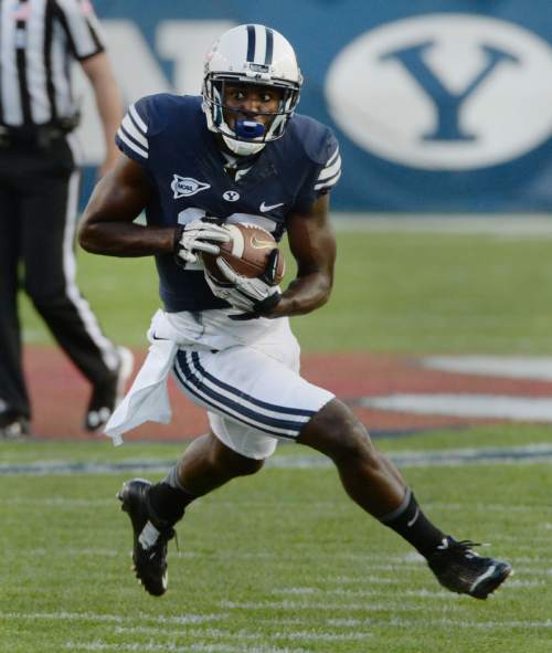 Steve Griffin  |  The Salt Lake Tribune


BYU Cougars wide receiver Devon Blackmon (19) runs upfield after catching a pass during game between BYU and Houston and LaVell Edwards Stadium in Provo, Thursday, September 11, 2014.